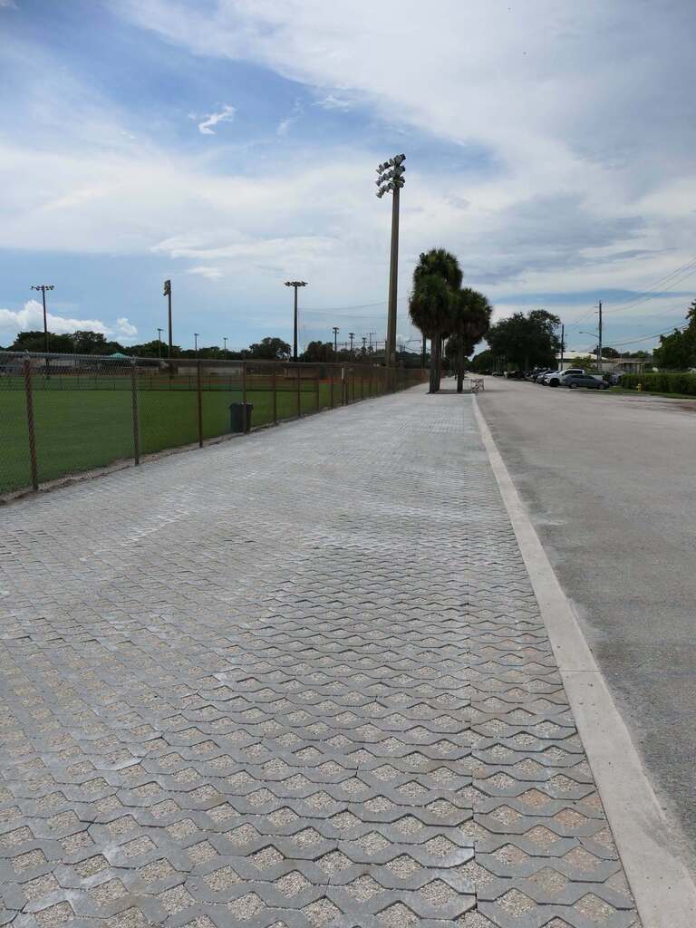 Photo of decorative pavers installed along a roadway and park