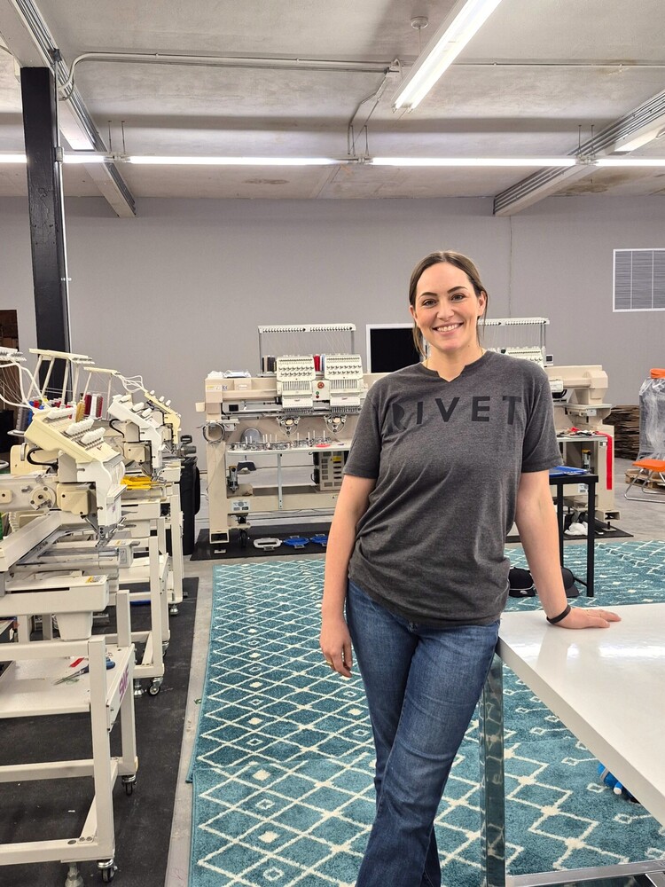 Jody Laird stands in her new location of her business Rivet Design Co.