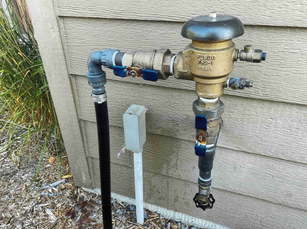 If you have underground sprinklers, you should also have a backflow prevention device similar to the one shown in this picture. These devices are required to help protect the public water supply from contamination. Thank you for helping us ensure a safe and reliable water system for everyone!