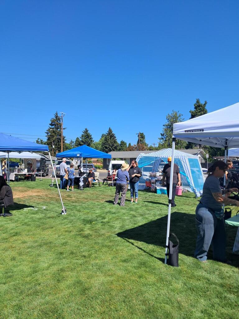 Image of people socializing and interacting with vendors at the July 18th, 2026, Farm to Table event.