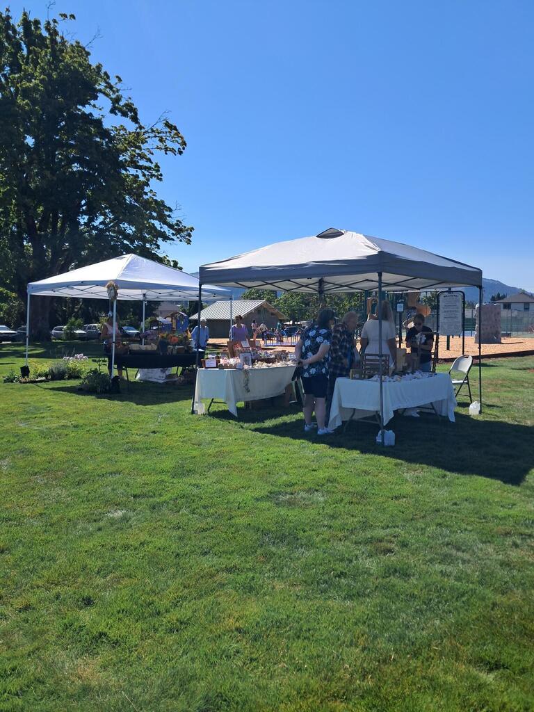Image of vendors at the July 18th, 2026, Farm to Table Event in Holt Park