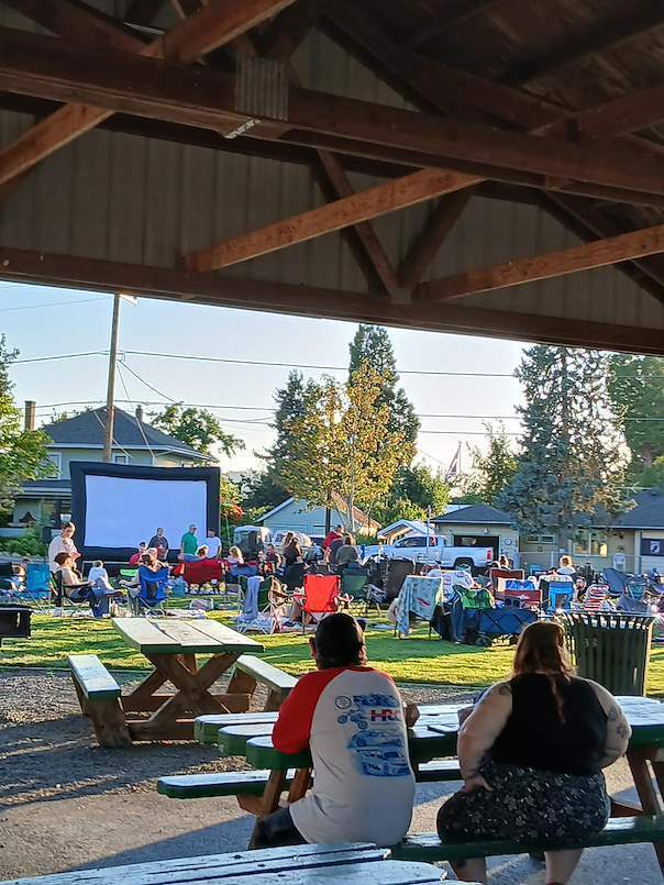 Image of people waiting at Holt Park for the movie to begin for the City of Creswell's Movies in the Park event.