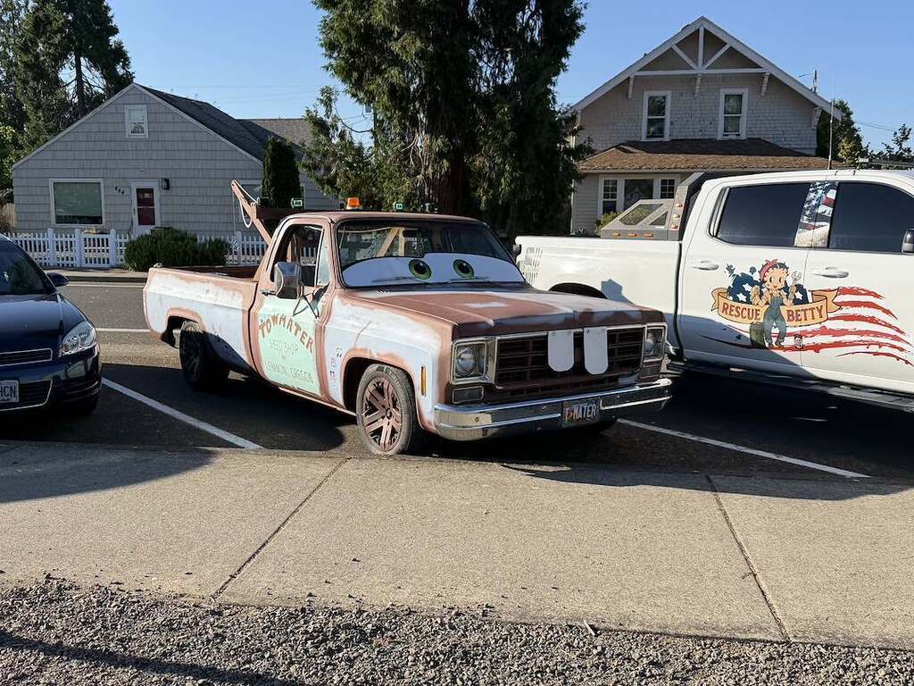 Image of a truck painted and decorated to look like the character "Mater" from the Cars franchise.