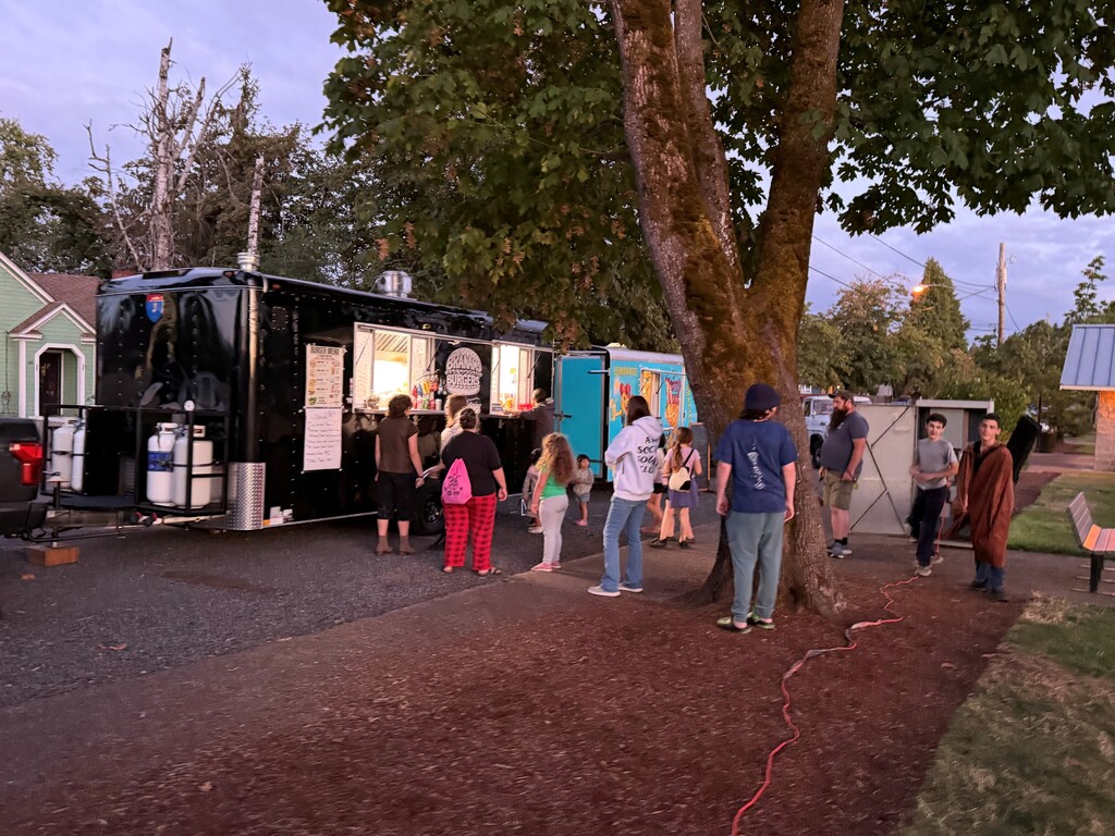 Image of movie goers in line for concessions at the Branham's Burgers Food Truck at Creswell's Movies in the Park event