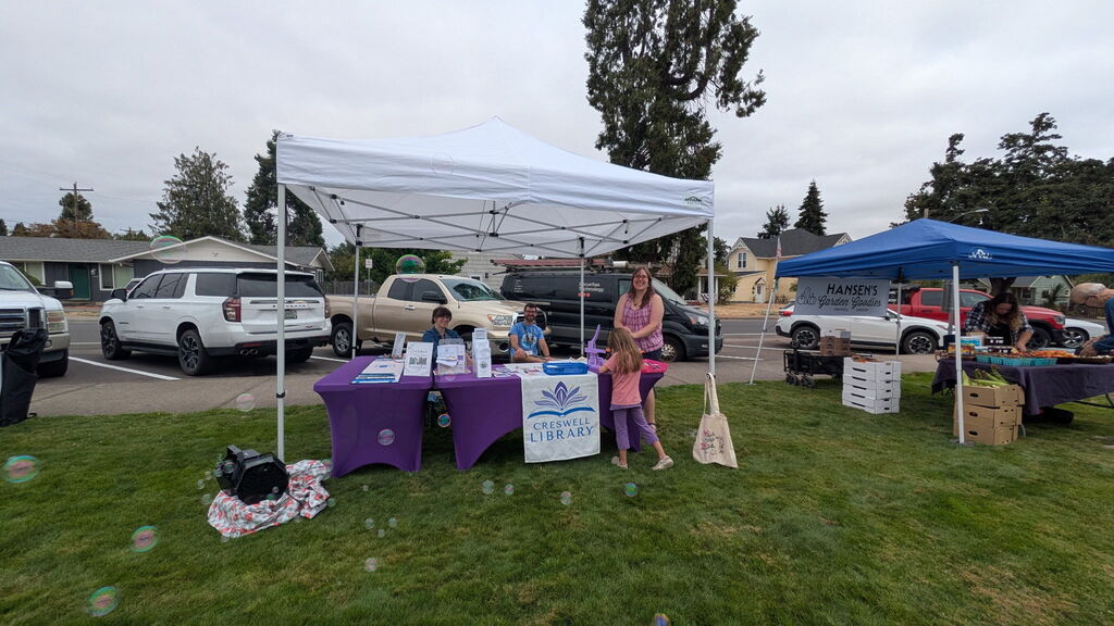 Image of the Creswell Library booth at the August 15th, 2026, Creswell Farm to Table event.