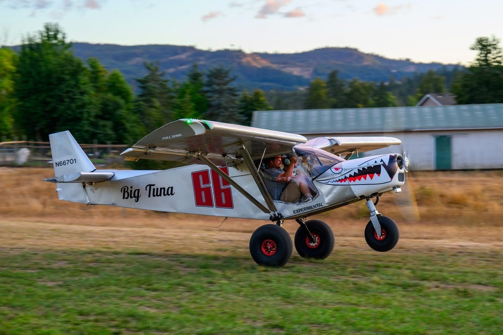 Image of the "Big Tuna" airplane beginning its takeoff at the Creswell STOL event