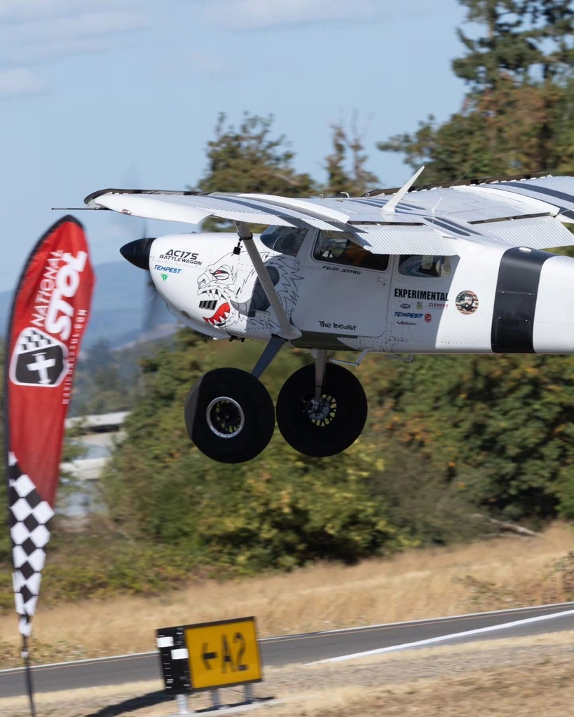 Image of an airplane just as it begins takeoff at the Creswell STOL event