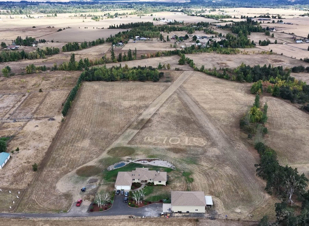 Arial image of a property that has the STOL logo mowed into it's grass
