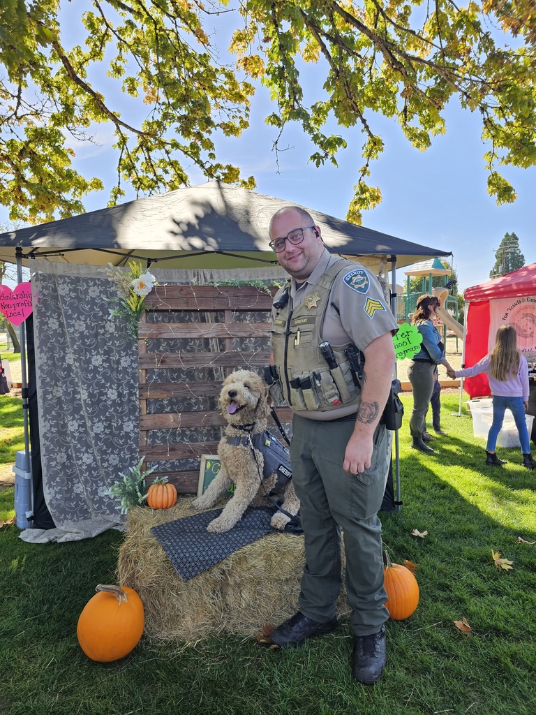 Image of Lane County Sheriff's Office Sergeant Speldrich with Corporal Carlton, the agency's therapy dog