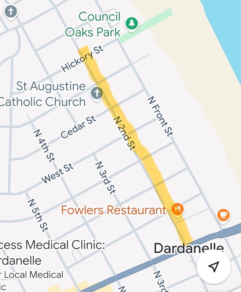 Map of downtown Dardanelle showing a highlighted yellow construction zone along North 2nd Street, extending north from the downtown area near Fowler’s Restaurant to Hickory Street by Council Oaks Park. Nearby street names and landmarks, including St. Augustine Catholic Church and North Front Street, are visible.