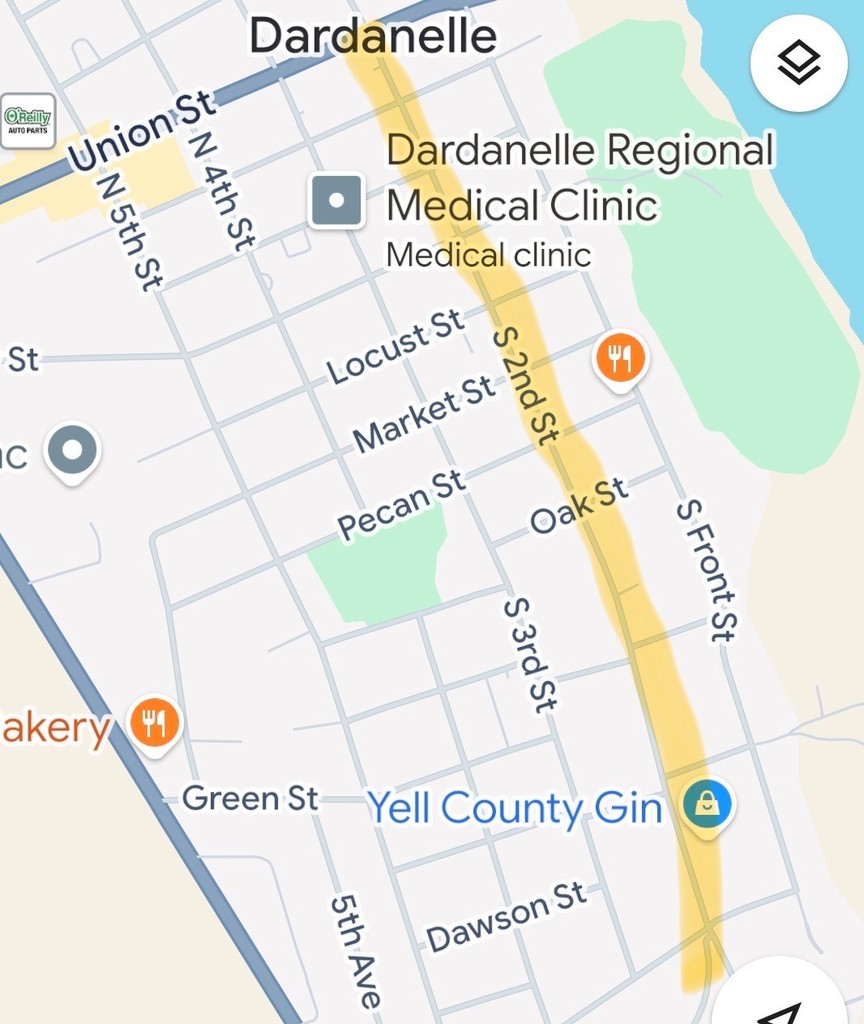 Map of Dardanelle, Arkansas highlighting a section of South 2nd Street in yellow from Union Street south past Oak Street and toward Dawson Street. Nearby landmarks include Dardanelle Regional Medical Clinic, Yell County Gin, and several cross streets including Locust Street, Market Street, Pecan Street, Oak Street, Green Street, and Dawson Street. The Arkansas River appears along the right side of the map.