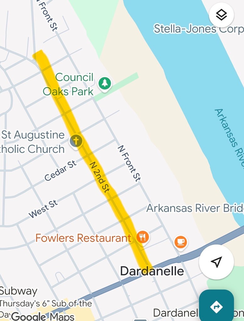 Screenshot of a Google Maps view of downtown Dardanelle, Arkansas, with a yellow highlighted route running north–south along North 2nd Street. Nearby labels include Council Oaks Park, St. Augustine Catholic Church, Fowler’s Restaurant, and the Arkansas River to the east.