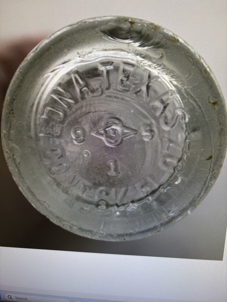 Bottom of an old Dr Pepper bottled stamped with Edna Texas