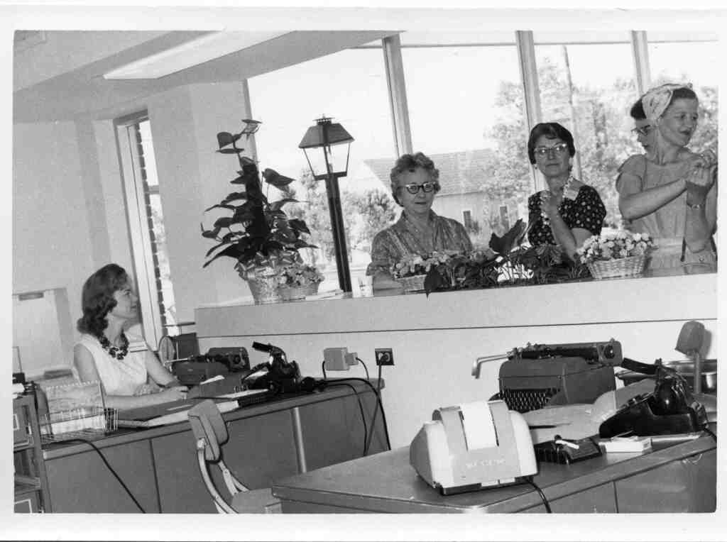 Customers wait at the counter of Houston Natural Gas Company in Edna