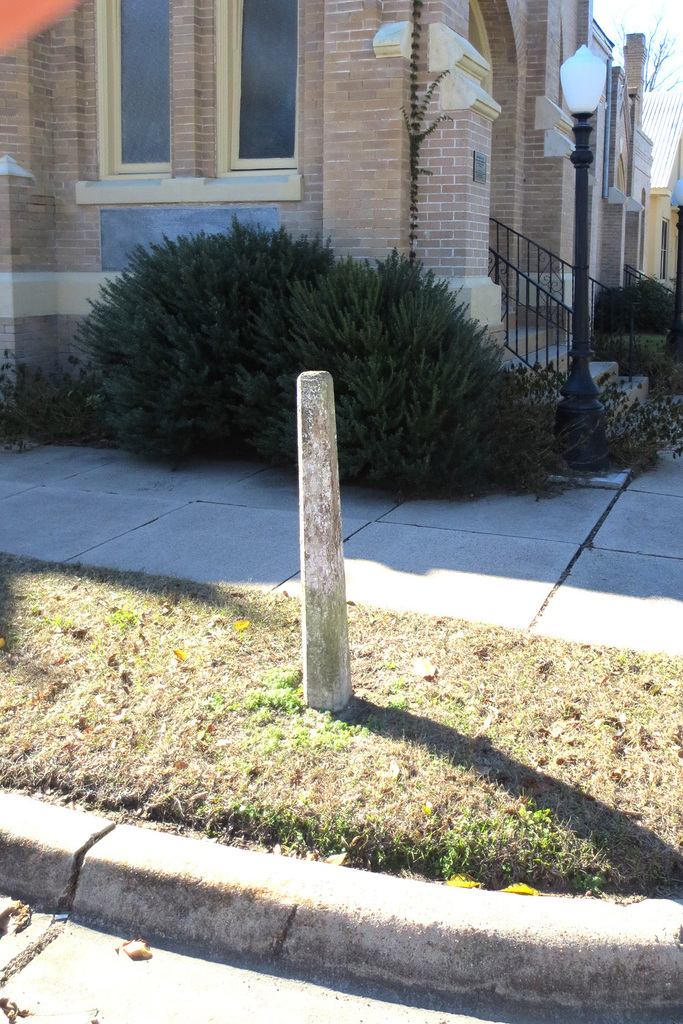 Concrete street marker at the corner of Church Street and Hanover Street