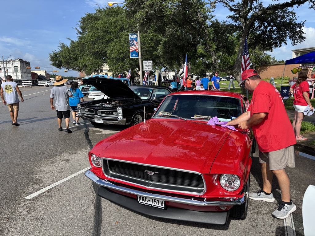 cleaning the water off a 1968 fastback Mustang