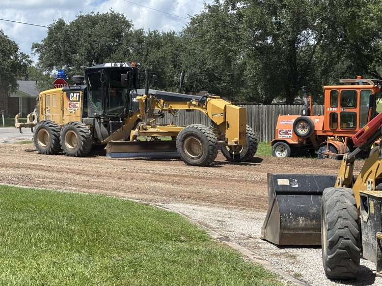 Work continues on Miracle Drive by Edna High School .