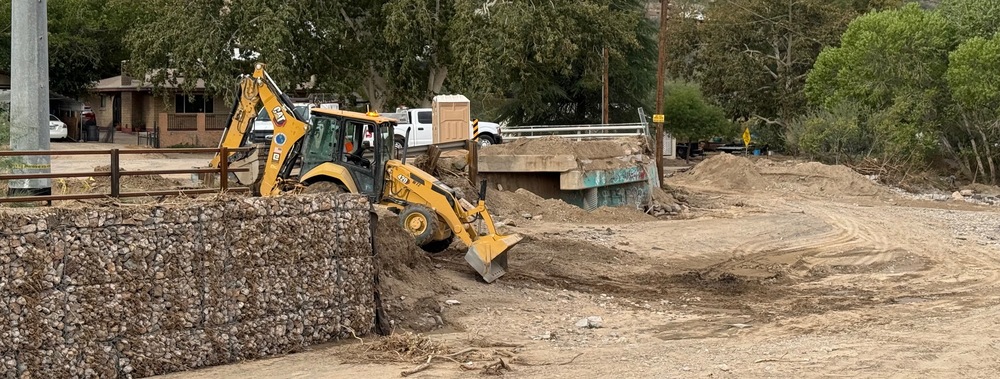 Front loader working in the creek