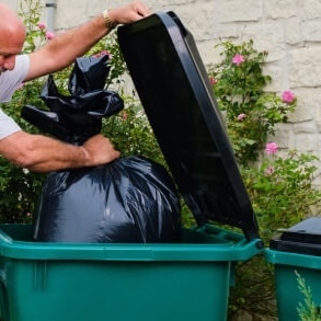 Trash going into the trash bin