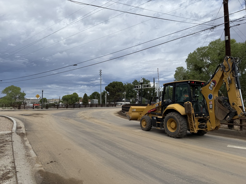Photo of Public Works at work clearing mud and debris