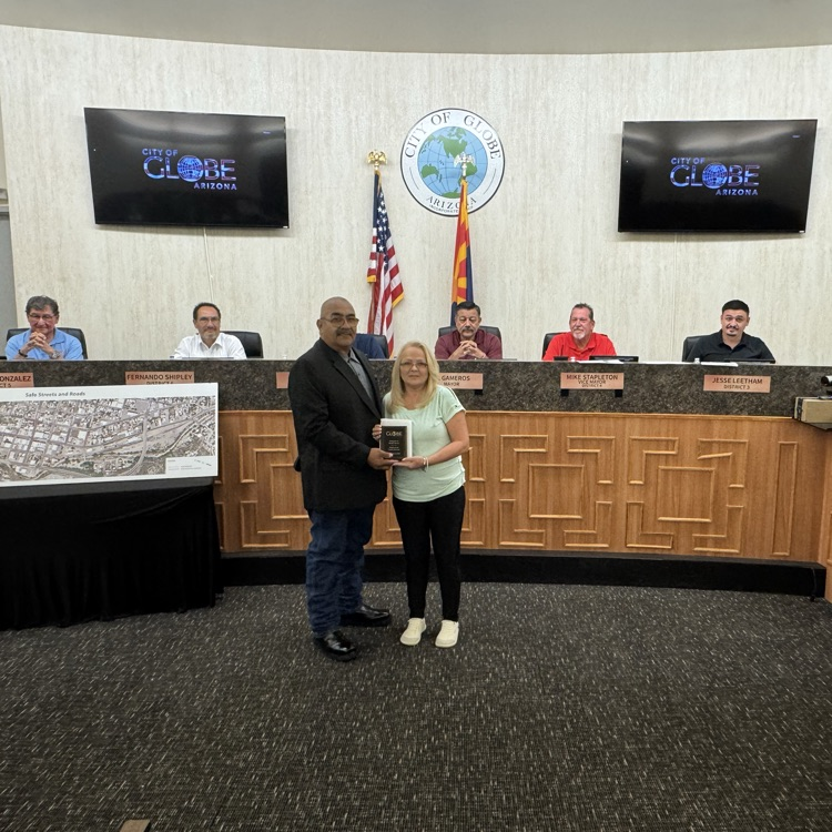 photo of Brandy Orozco with John Angulo in front of Council