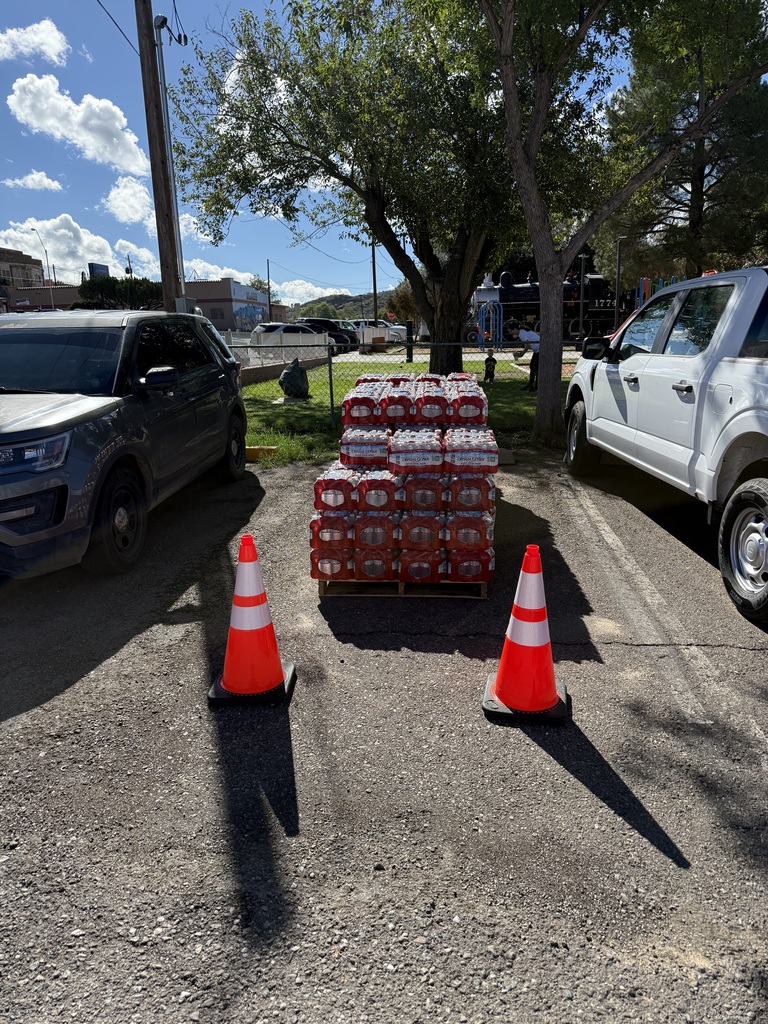 Water pallets located at City Hall behind orange cones