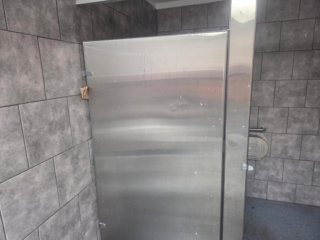 Vandalism to stalls in restroom