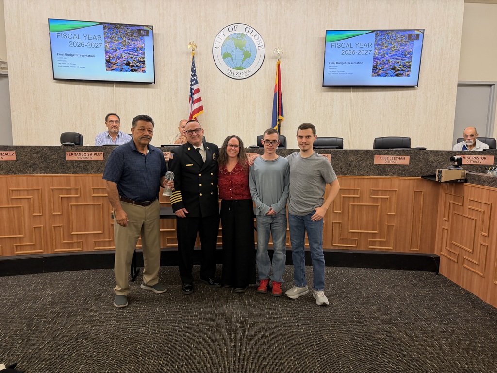 Chief Gary Robinson with his family, receiving 25 Years of Service recognition