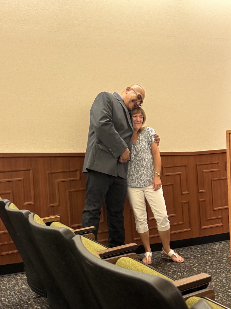 John Angulo congratulating Jodi Martin