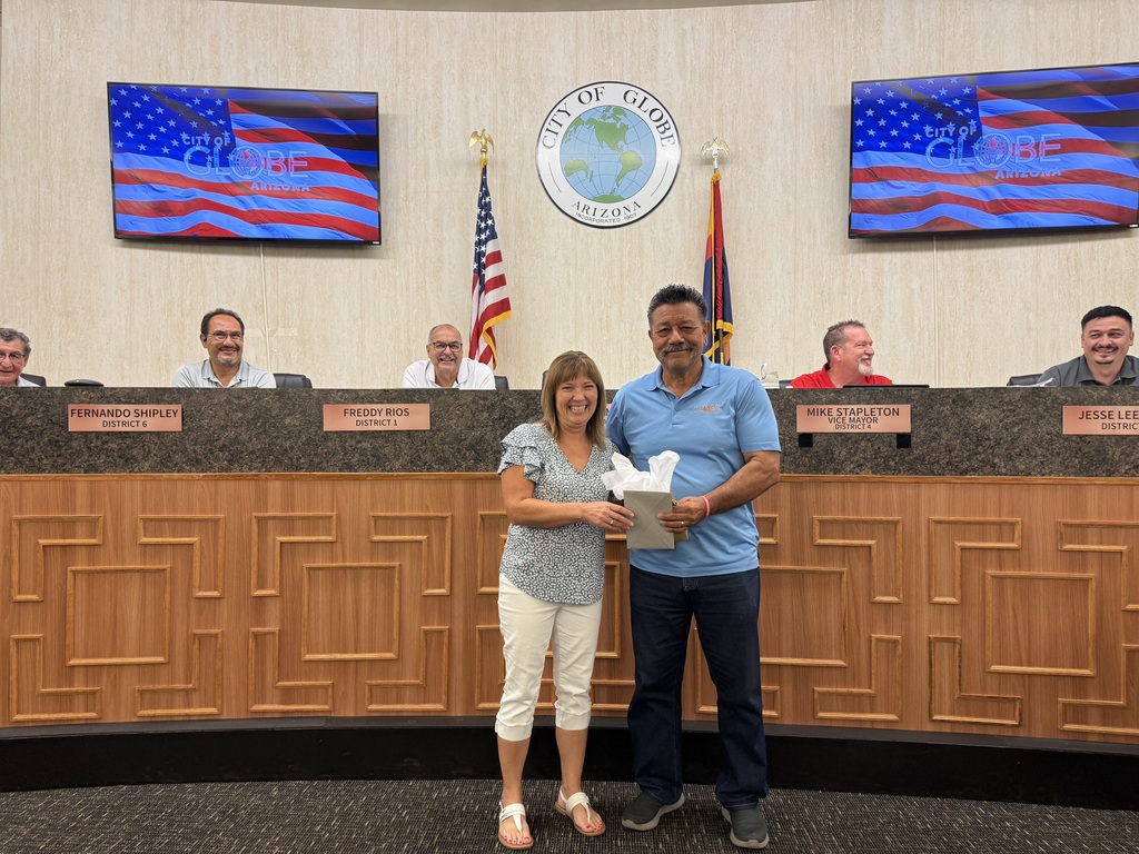 Mayor Al Gameros presenting Jodi with her retirement watch