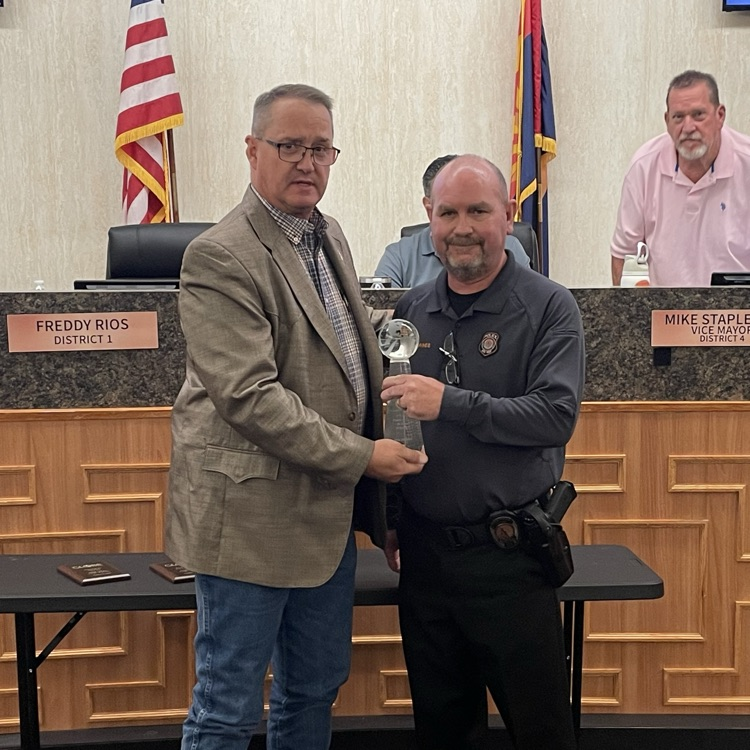 Chief Walters presenting Commander Haines with his 30 years of service Globe