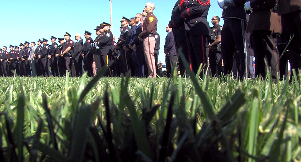 Law Enforcement from all across the state watch on during the 2024 Law Enforcement Memorial Ceremony