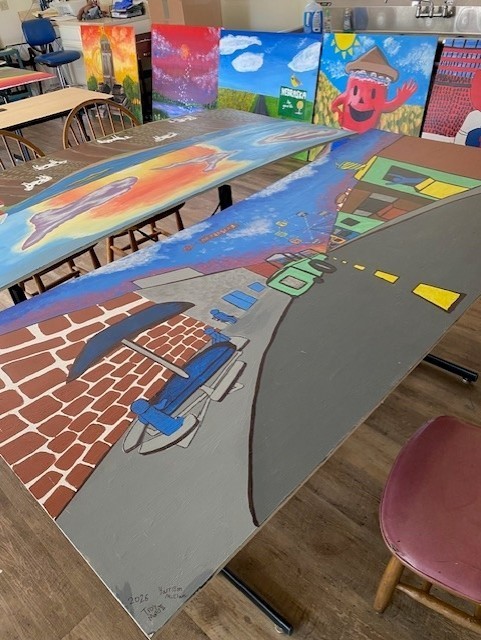 Several completed murals painted and ready to be installed at Kids Kingdom