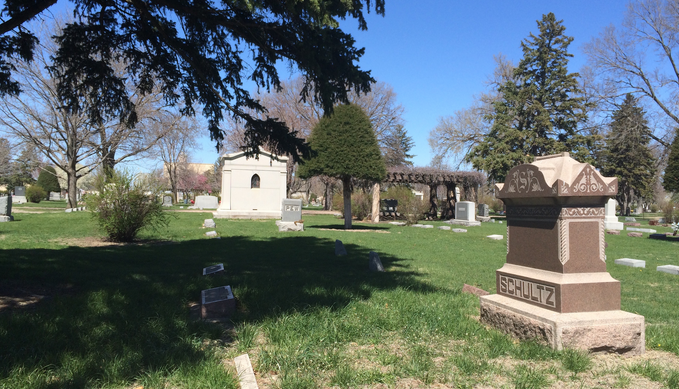 Grand Island Cemetery headstones on a clear, sunny day