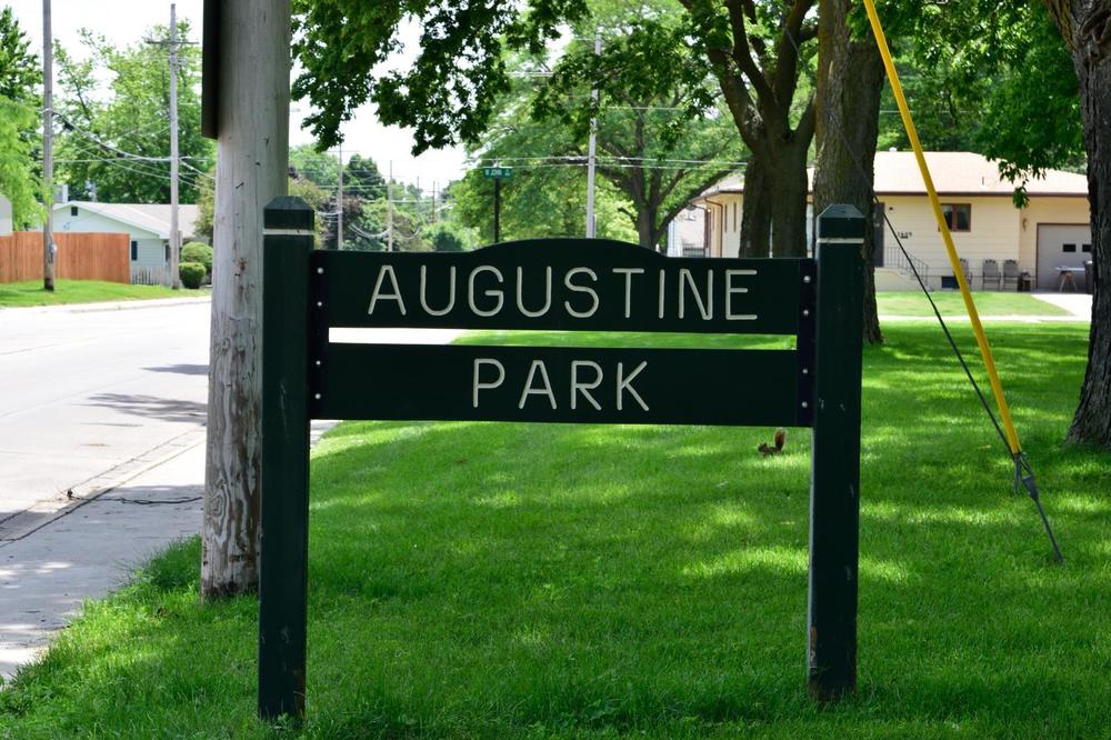 Photo of the sign at Augustine Park on a sunny day