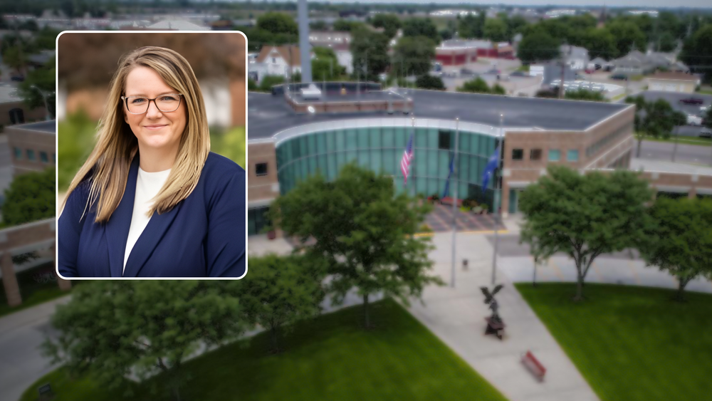 Photo of new finance director Chelsey Steinke over a blurred photo of City Hall