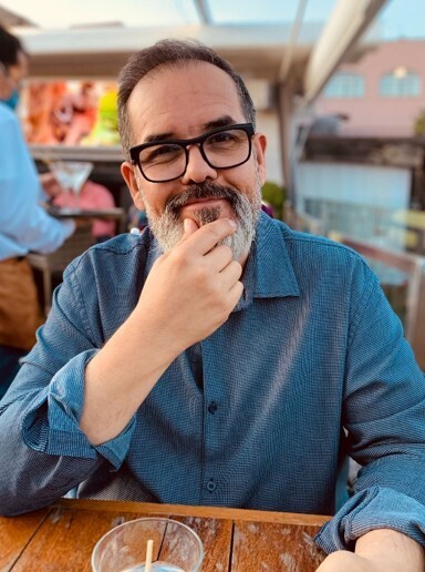Photo of Pedro Martin staring back at the camera