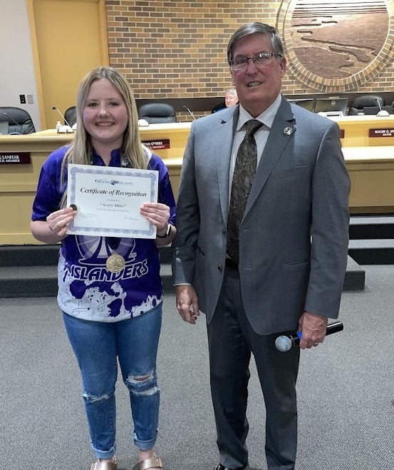 Grand Island Senior High bowler receiving a certificate from Mayor Steele