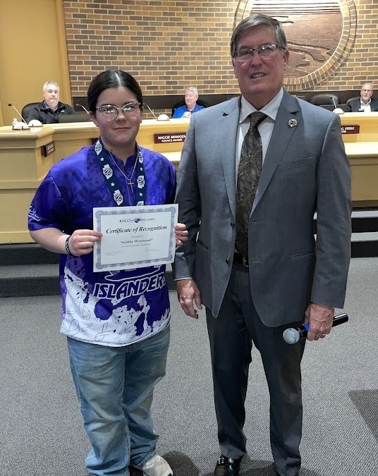 Grand Island Senior High bowler receiving a certificate from Mayor Steele