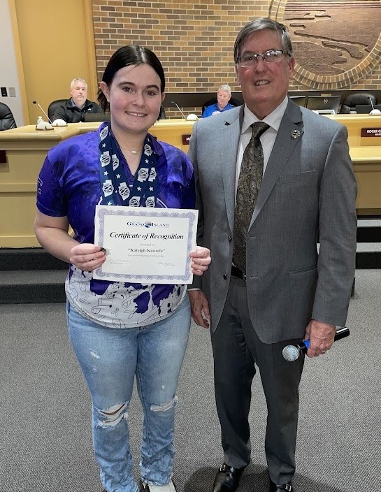Grand Island Senior High bowler receiving a certificate from Mayor Steele
