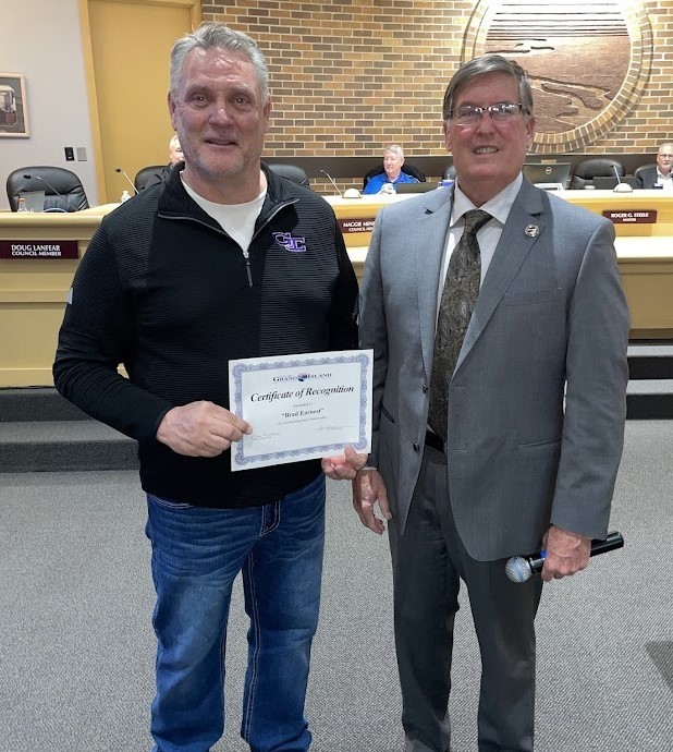 Grand Island Senior High bowler receiving a certificate from Mayor Steele