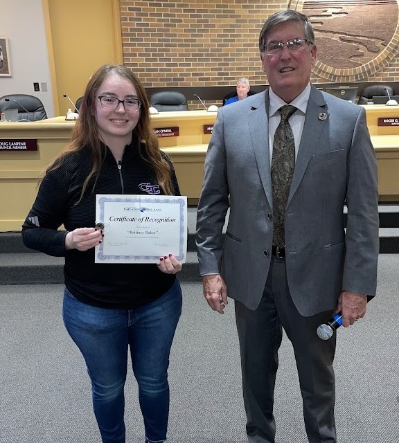 Grand Island Senior High bowler receiving a certificate from Mayor Steele