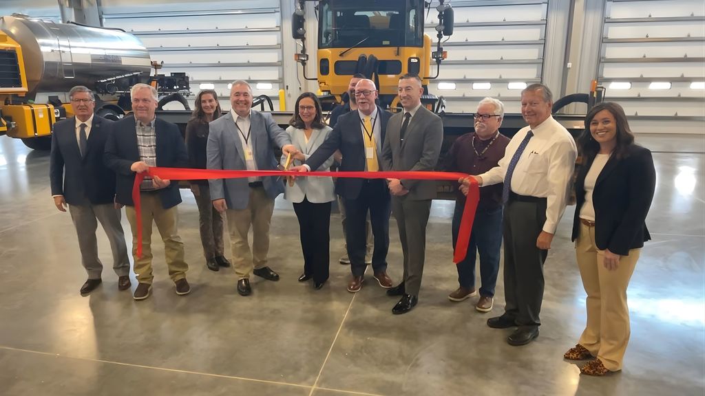 Several officials pose for a photo before officially cutting the ribbon