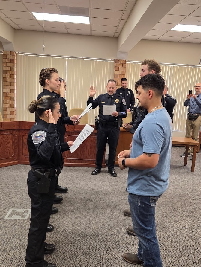 GIPD Administration swearing in four new officers