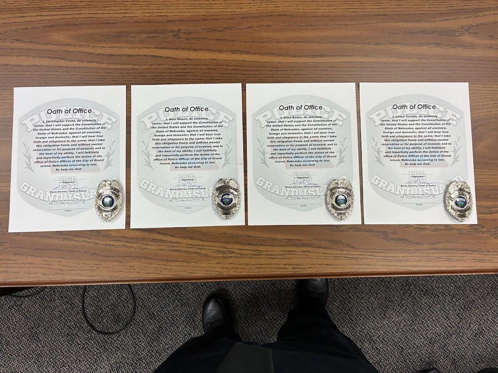GIPD Administration swearing in four new officers