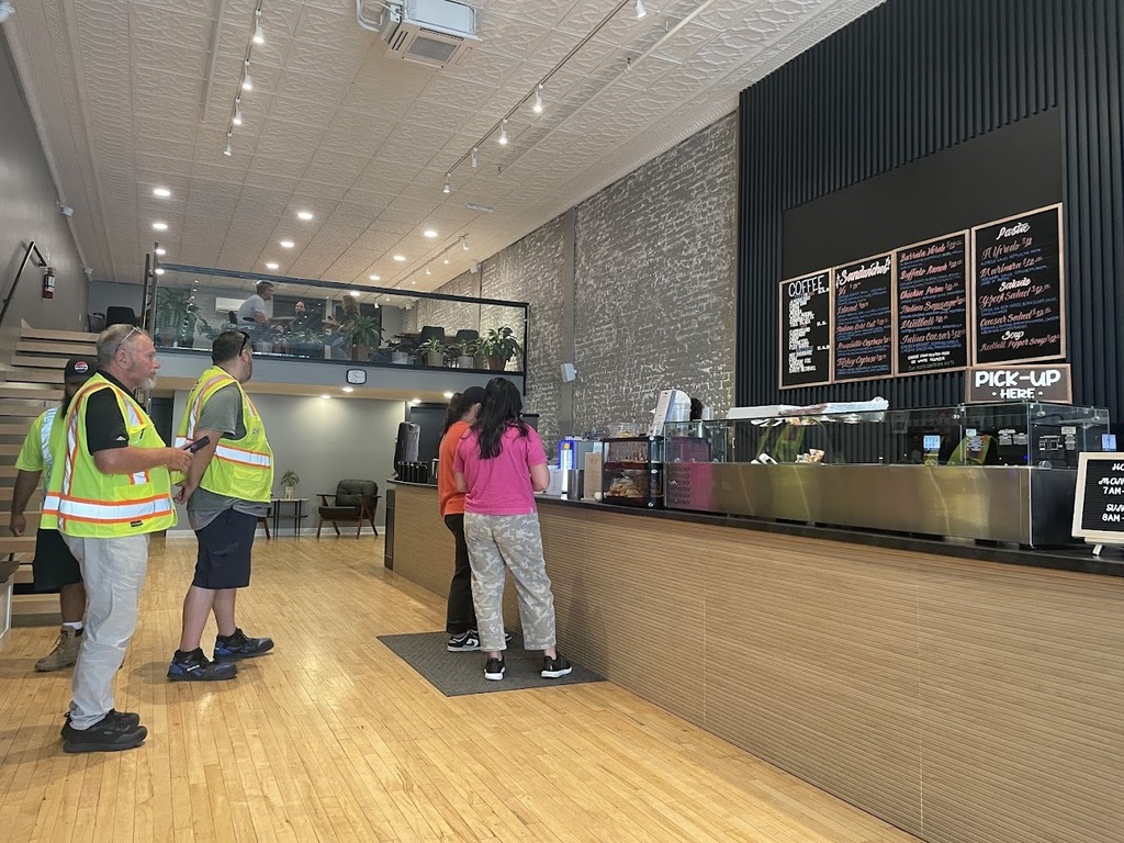 Customers ordering food at V's Deli