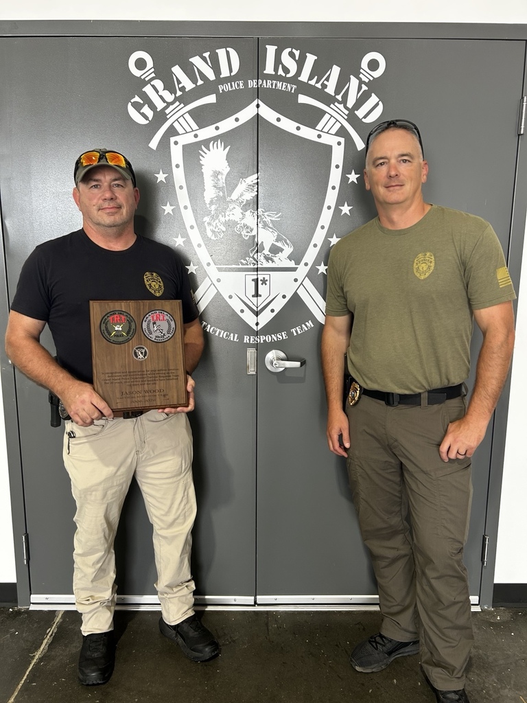 Sgt. Jason Wood receiving a 20-year recognition plaque