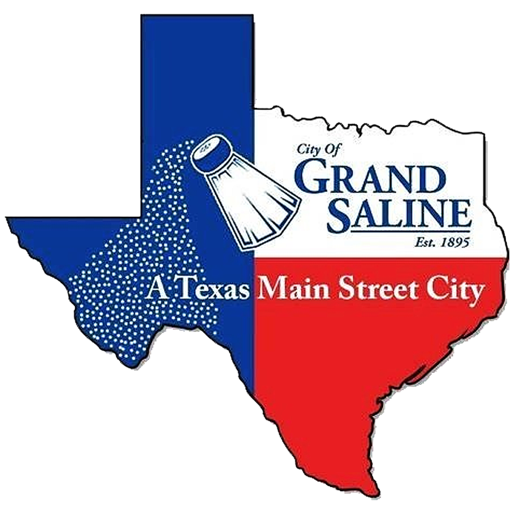 Logo for the City of Grand Saline, Texas, shaped like the state of Texas and divided into blue, white, and red sections. The design features a salt shaker pouring salt across the blue section, with the words “City of Grand Saline, Est. 1895” and “A Texas Main Street City” displayed across the logo.