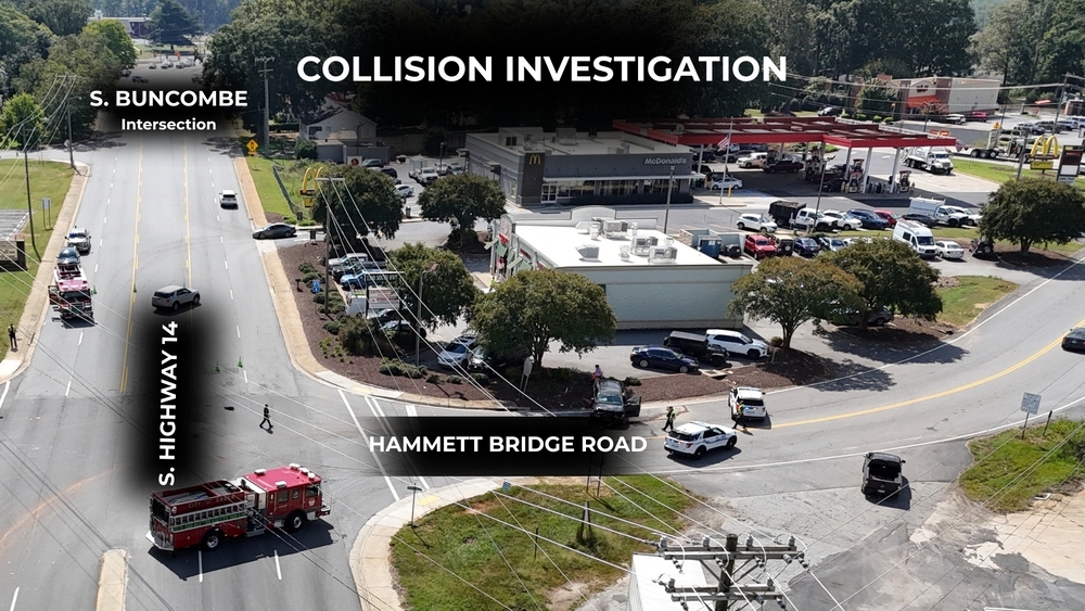 Drone shot of intersection of S. Highway 14 and Hammett Bridge Rd. Title is Collision Investigation. Roads are labelled including S. Buncombe Rd. intersection