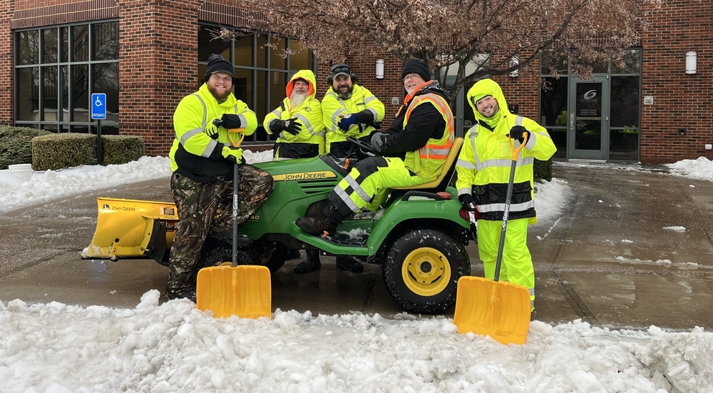 Picture of Urban Parks team working to clear the sidewalks in front of City Hall